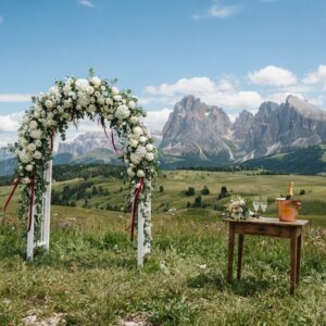 Floral arch on the endless meadows of Alpe di Siusi with Dolomites panorama – vow renewal at Alpe di Siusi, Italy – Kiss Me Italy